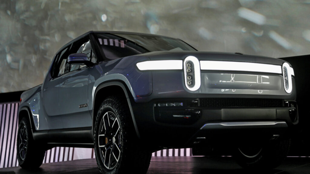 Electric pickup truck driving through rugged terrain with zero emissions