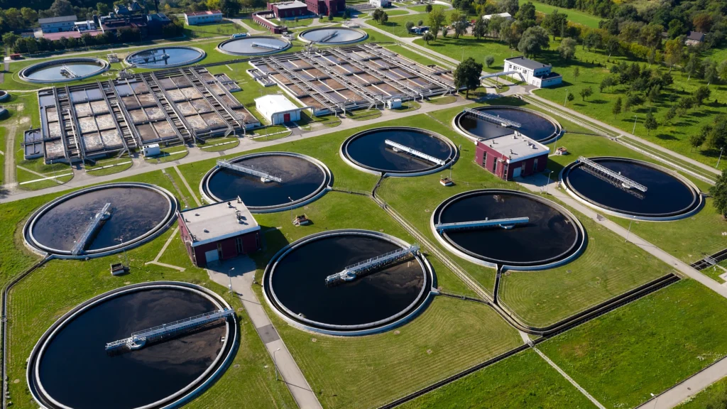 Infographic illustrating the stages of municipal water treatment, including coagulation, sedimentation, filtration, and disinfection.