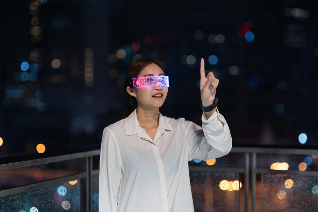 Futuristic AR headset glowing with data overlays and hand gesture interaction, symbolizing Meta’s push into immersive extended reality.