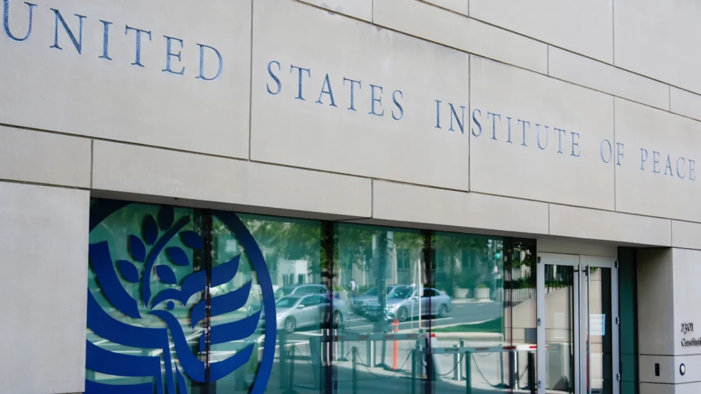 Exterior of the US Institute of Peace headquarters in Washington, D.C., symbolizing institutional authority and recent controversy.