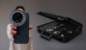 iPhone mounted on a professional mobile filmmaking rig with a lens, grip, and mic, capturing a cinematic shot on set.